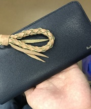 紺色の長財布 ポールスミス製 中に記名式スイカの定期と学生証ありの画像