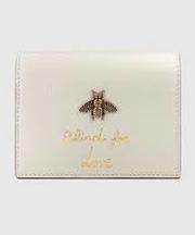 GUCCI 二つ折り財布 白 蜂のマークの画像