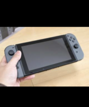 ニンテンドースイッチ本体（携帯モード、グレーのコントローラ）の画像