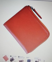 オレンジ色のチャック式カード入れを紛失してしまいました。の画像