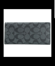 黒と灰色のコーチの三つ折長財布の画像