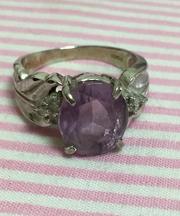 紫の石のついた指輪の画像