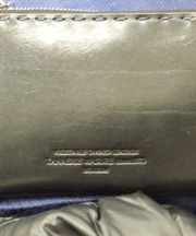 財布 黒い革製の長財布 タケオキクチの画像